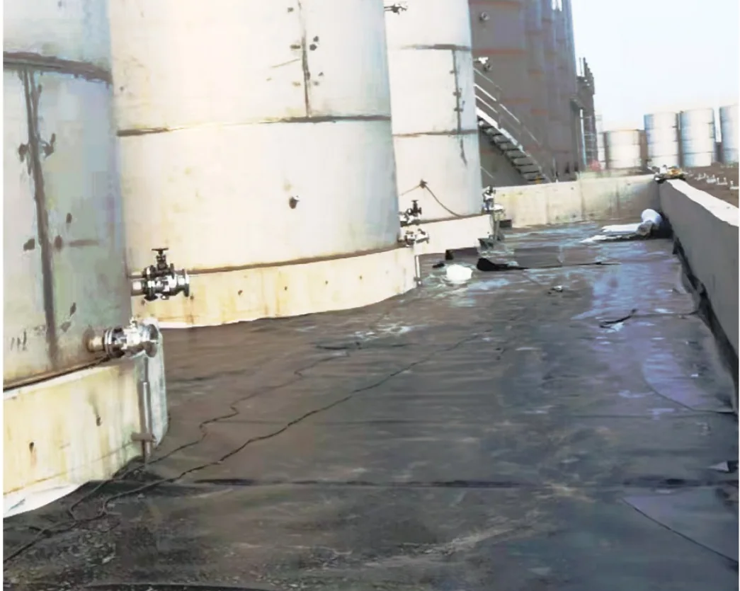 Lined secondary containment area around industrial storage tanks